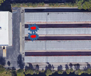 The UAS captured a picture of warehouses from directly above (smoke location added in red and blue icons).