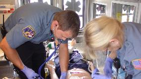 EMTs training in the back of an ambulance